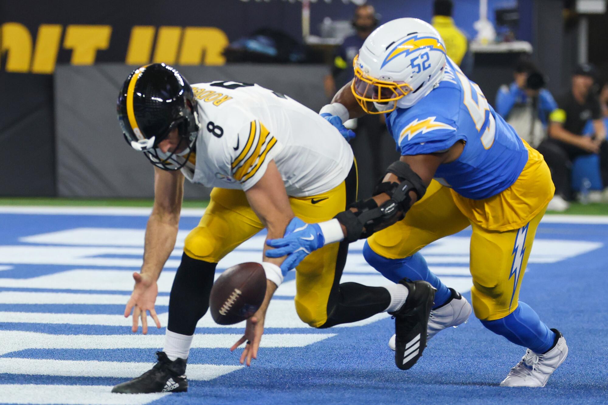 Steelers quarterback Aaron Rodgers fumbles the ball as he's sacked by Chargers linebacker Khalil Mack during a game last year