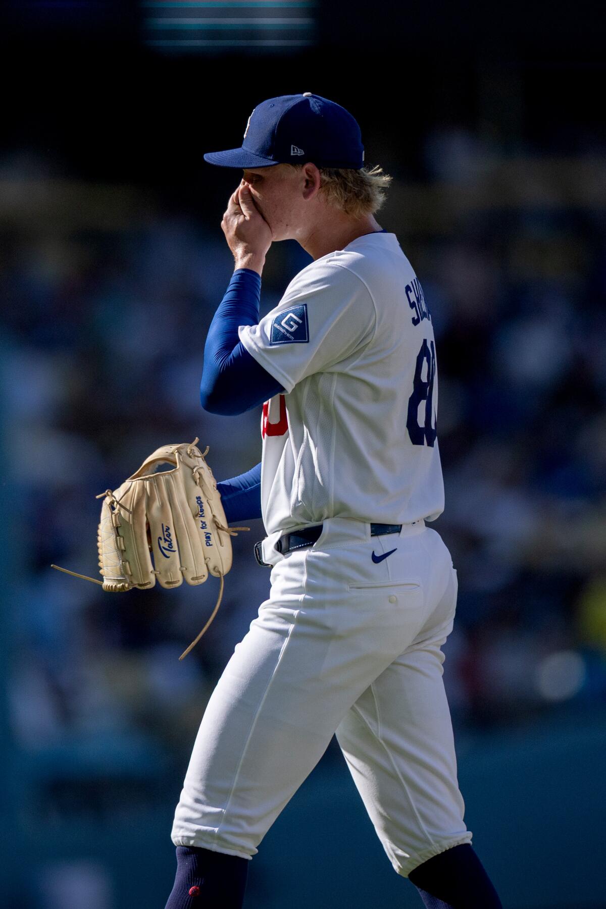 Dodgers pitcher Emmet Sheehan walks off the field during the third inning against the Red Sox on Sunday.