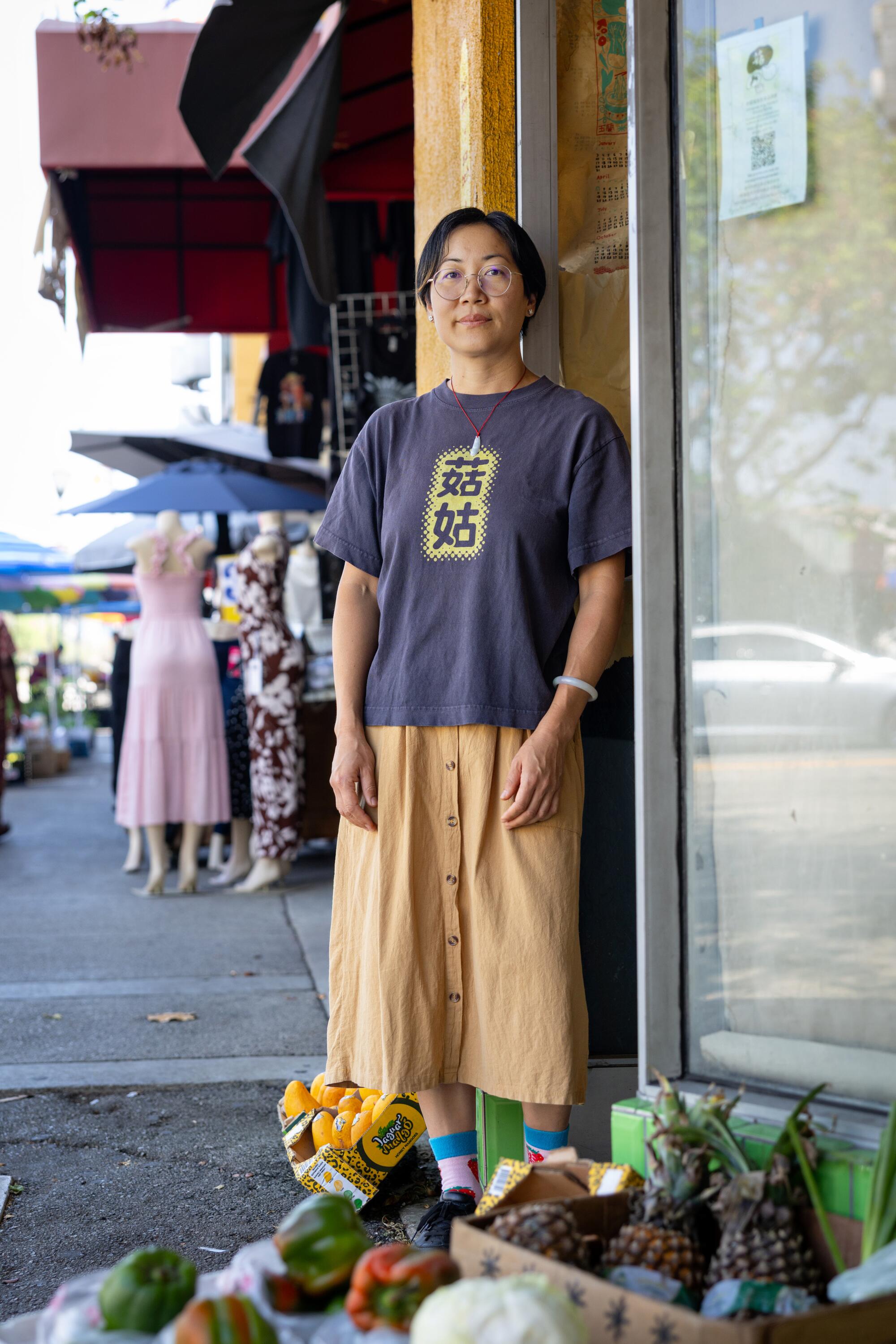 Jessica Wang stands outside Gu Grocery, the storefront she's struggling to open in Chinatown.
