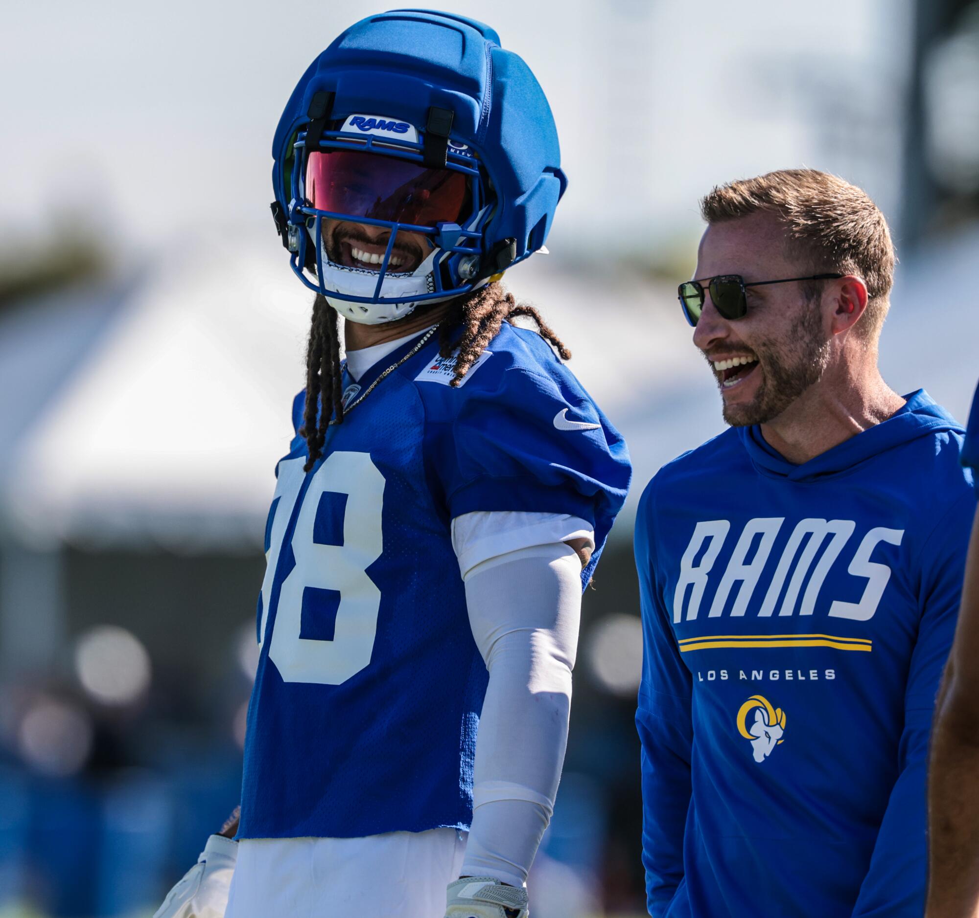 Rams coach Sean McVay shares a laugh with receiver Jordan Whittington during training camp on July 26.