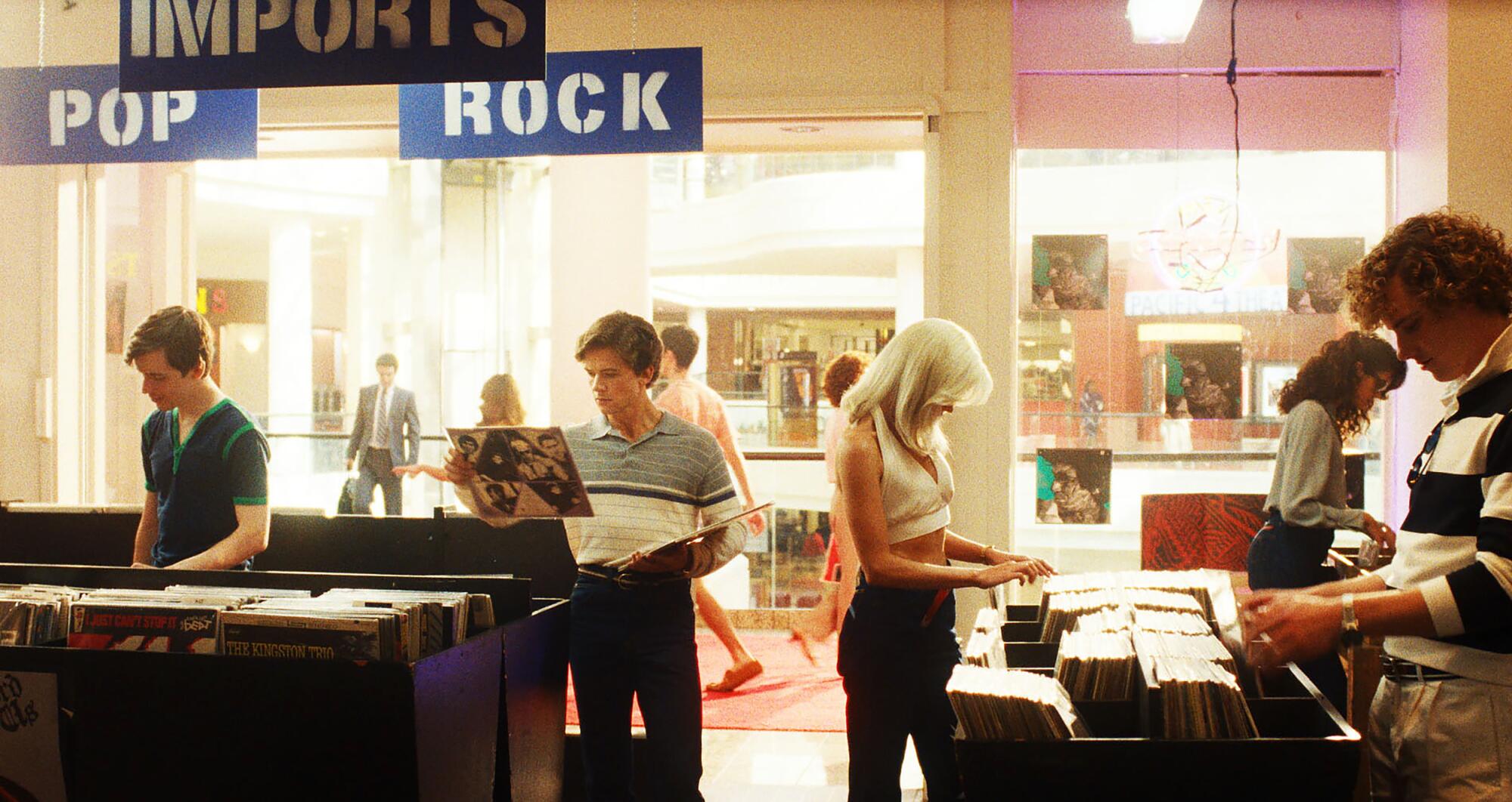 Men and women shop for records in a retro version of the Sherman Oaks Galleria.