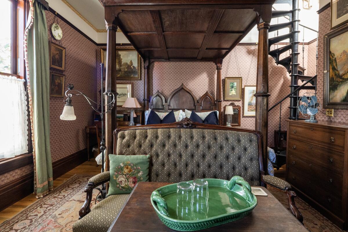 MONROVIA, CA - JULY 28, 2026: One of two rooms at the Saxony Cottage with a spiral staircase leading to an upstairs bedroom at the Arthur Blair Historic Inn in Monrovia, CA on Tuesday, July 28, 2026. The cottage is a new construction replicating the historic look of the other Arthur Blair houses. (Myung J. Chun / Los Angeles Times)