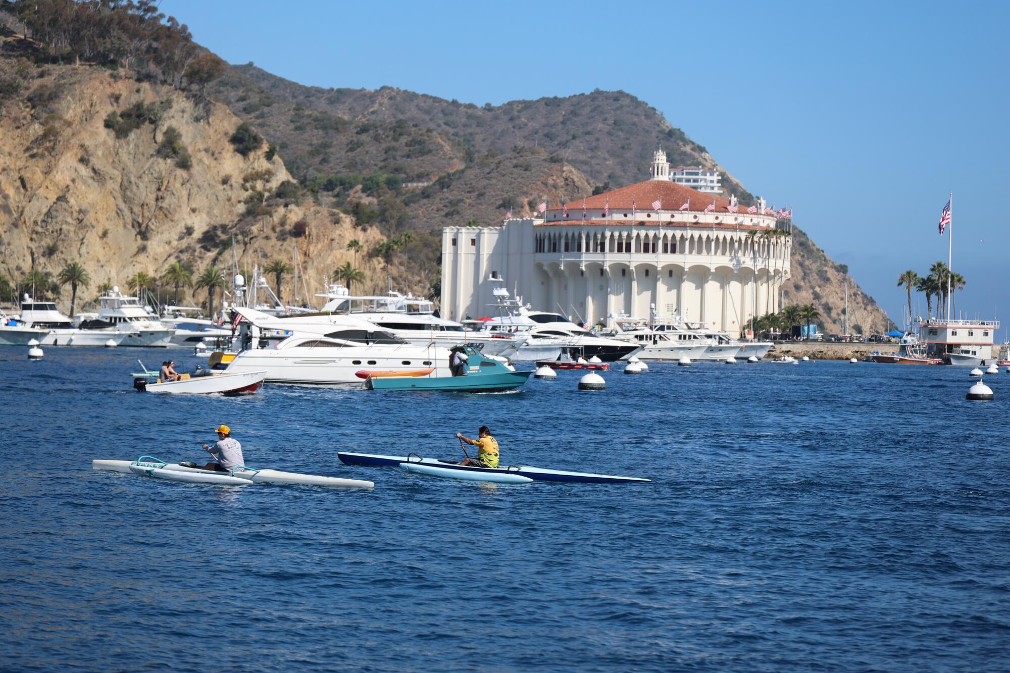People enjoy the summer weather at Catalina Island Harbor with a view of the Catalina Casino in Avalon. 