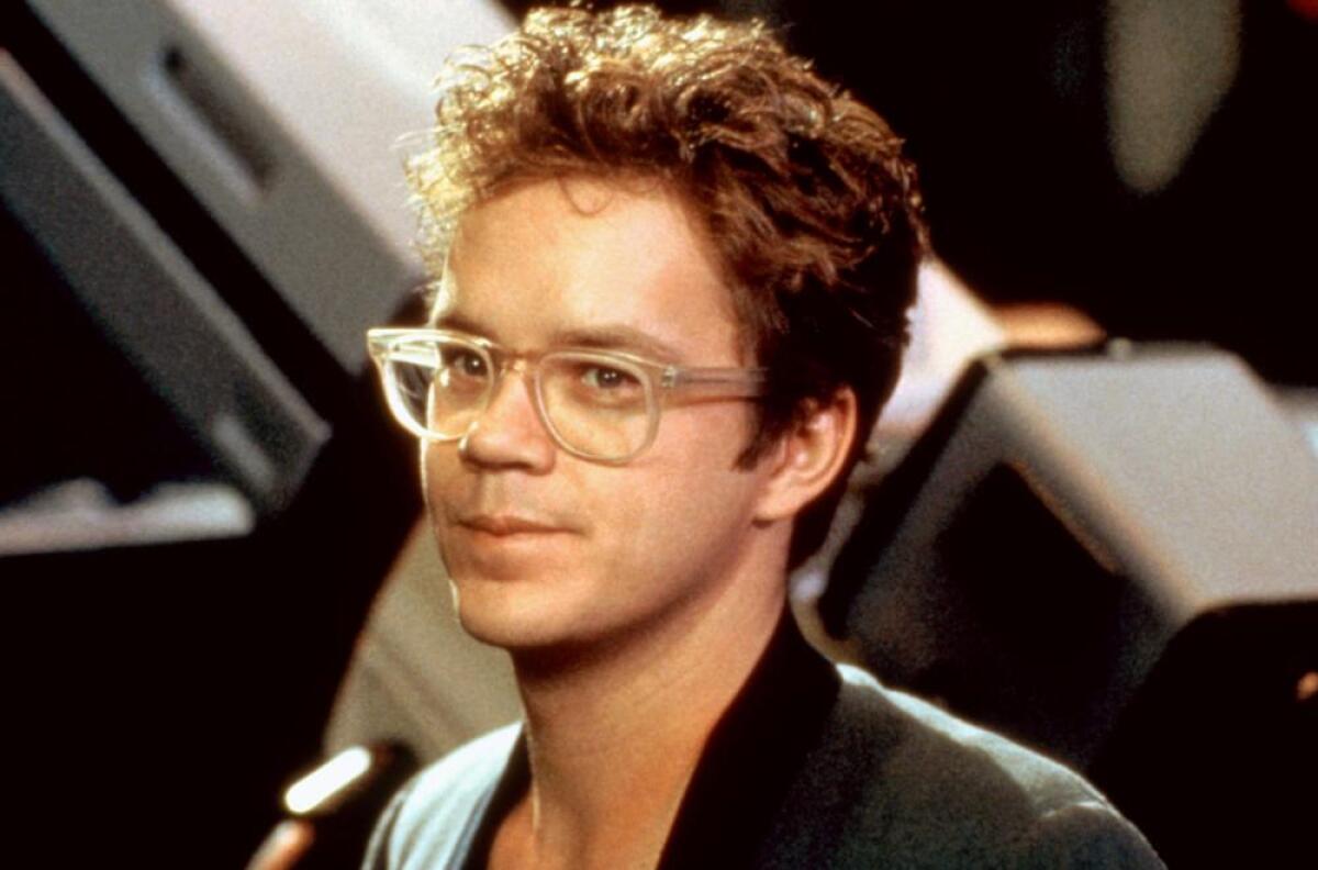 A man in glasses shoots a music video.
