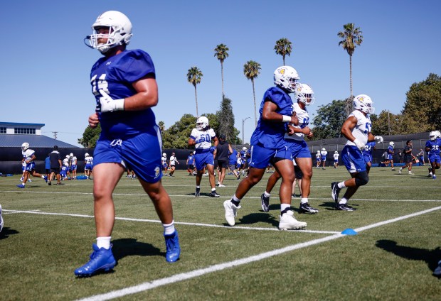 San Jose State University football players head to their assignments at SJSU's first training camp football practice on the practice field at San Jose State University in San Jose, Calif., on Wednesday, July 29, 2026. (Nhat V. Meyer/Bay Area News Group)