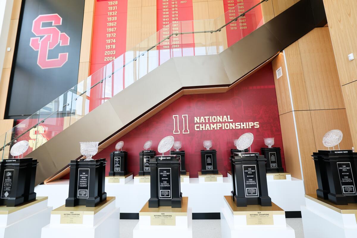 Trophies won by the USC football program on display at the Bloom Football Performance Center.