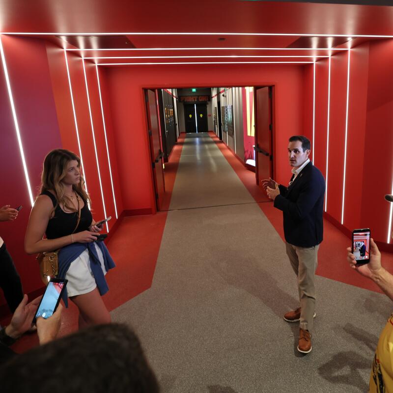  Jeff Fucci, USC senior associate athletic director, leads the media on a tour of the Bloom Football Performance Center.