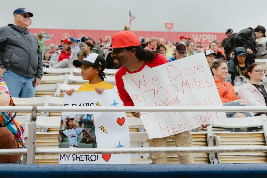 Fans from Delaware drove 1700 miles to see Mo'Ne Davis play in the inaugural game of the Women's Pro Baseball League. Springfield, IL, August 1, 2026.