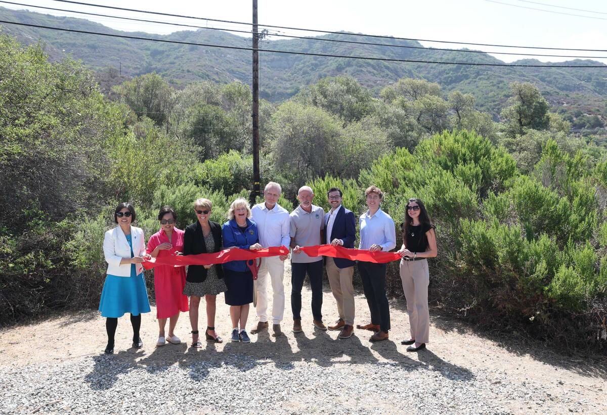 State, county, local officials at a ceremony to mark completion of Laguna Canyon Road improvements Tuesday.