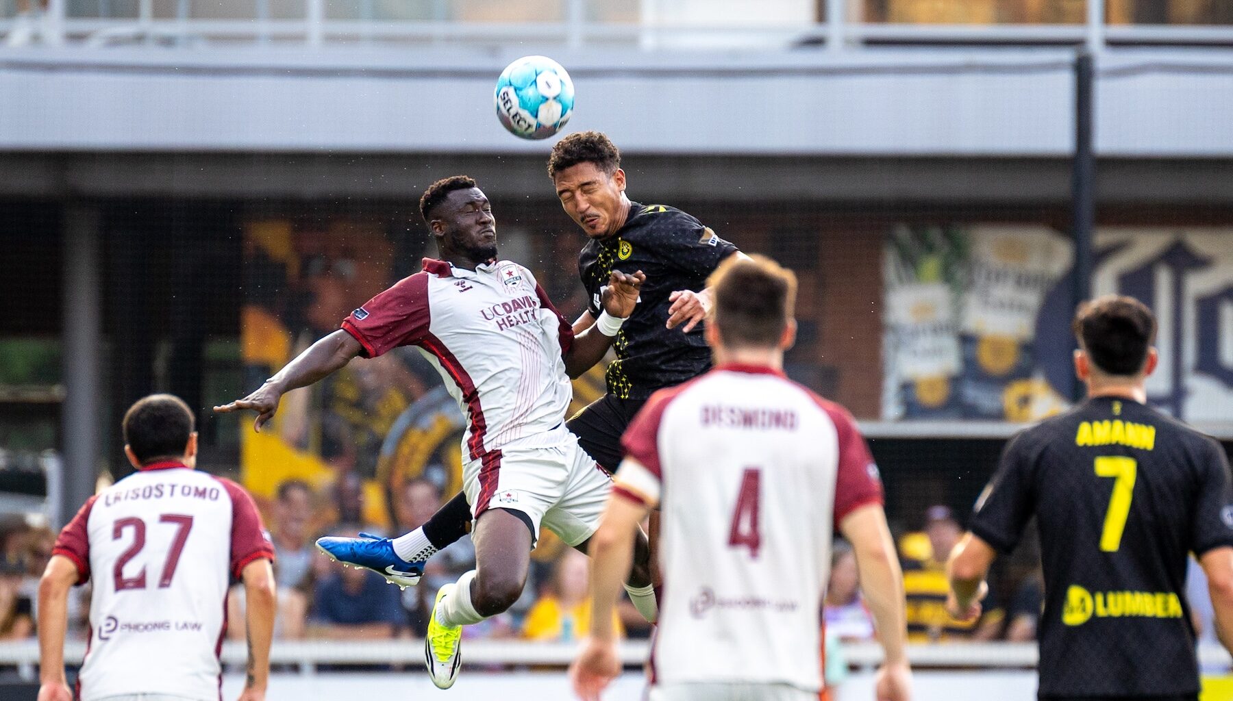 Victor Souza battles for a header with Sacramento Republic FC forward Forster Ajago in the Pittsburgh Riverhounds