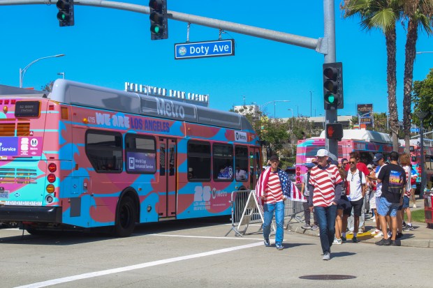 Team USA fans walking past a LA Metro bus carrying more fans to the U.S. opener against Paraguay of the 2026 FIFA World Cup on Friday, June 12, 2026. (Photo by Christina Merino, Press-Telegram/SCNG)
