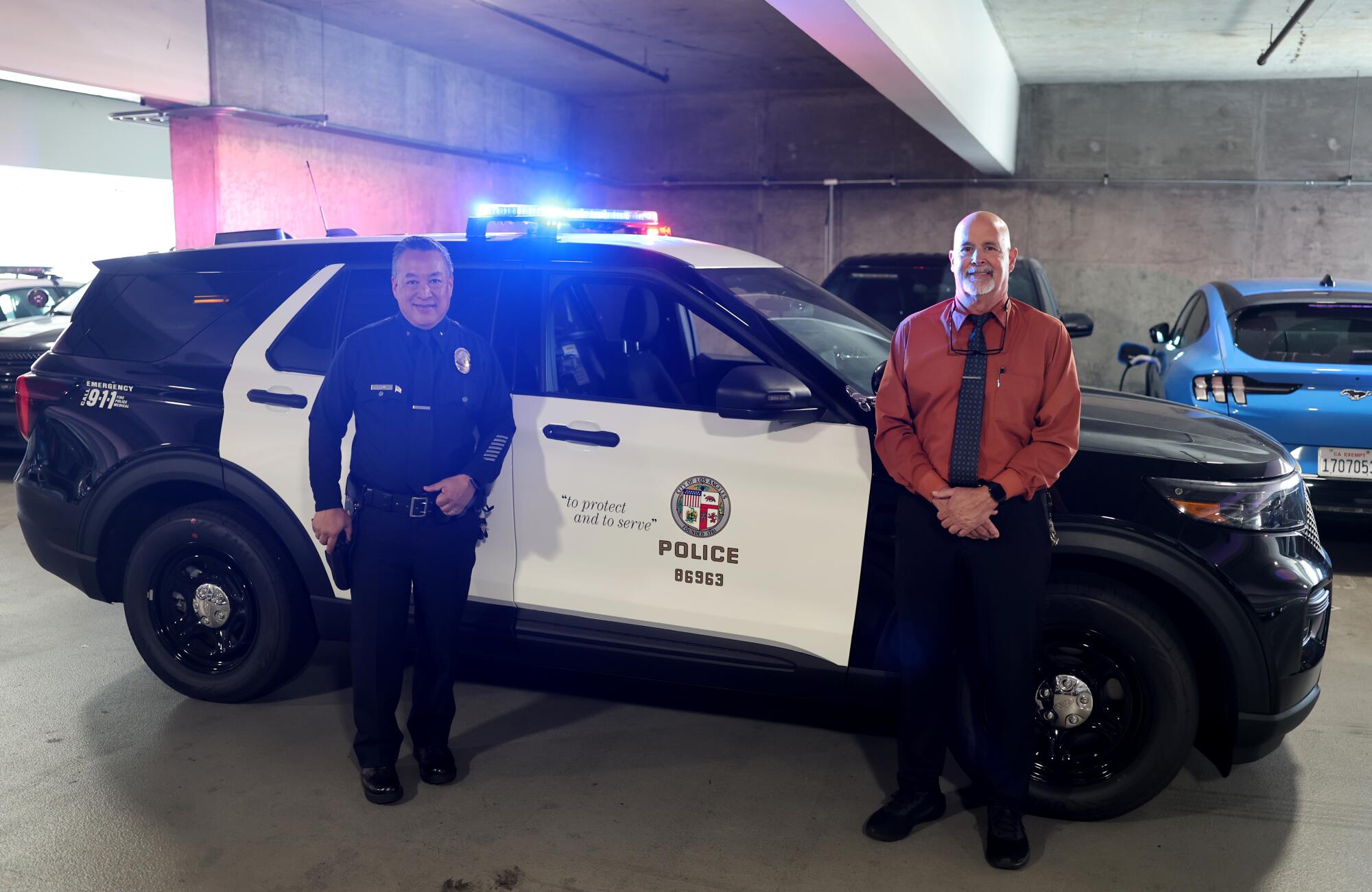 LAPD Commander Blake Chow, left, and Greg Field, director of police transportation, Motor Transport Division.