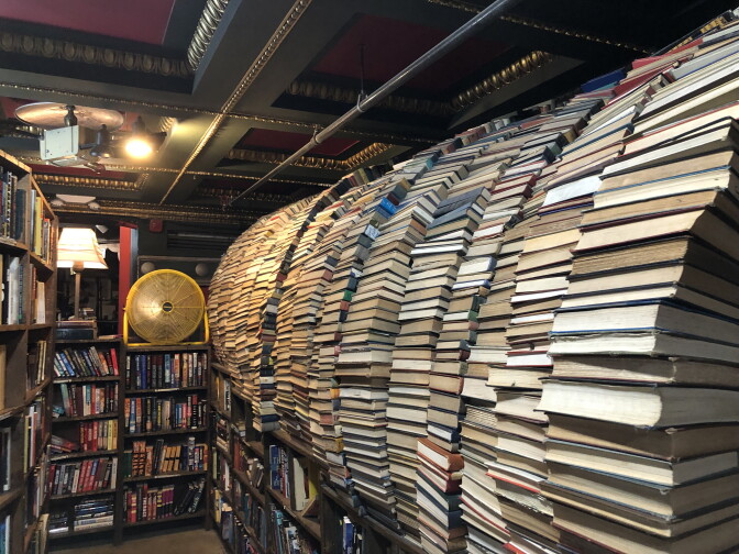 A row of books stacked inside a bookstore.