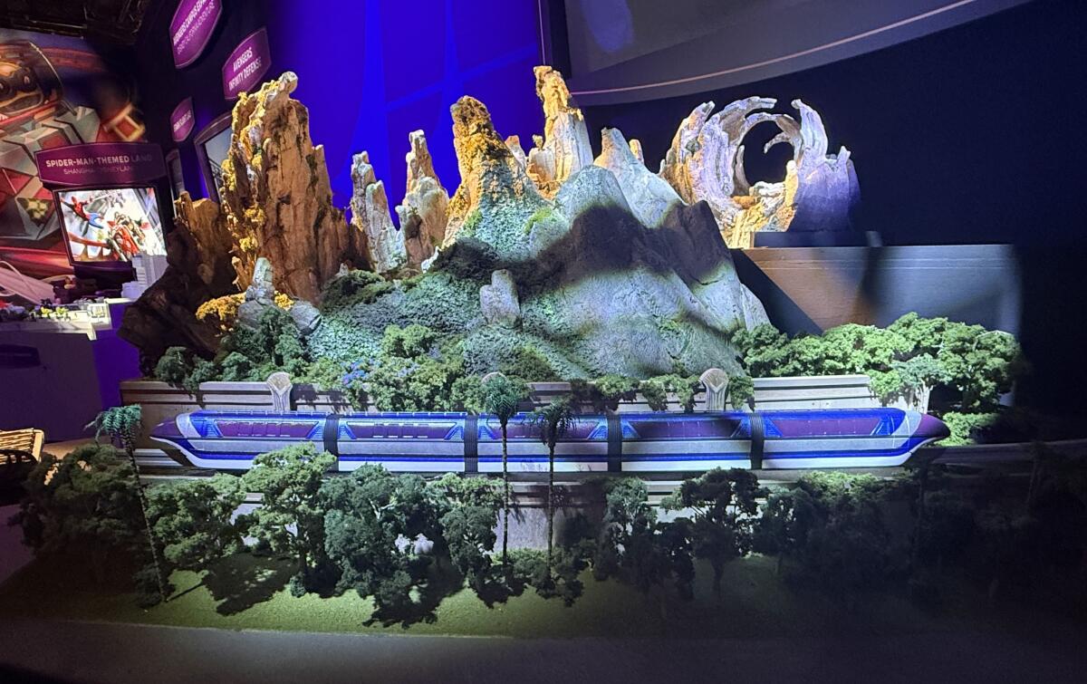 A model of the forthcoming "Avatar"-inspired area includes a monorail in a lush forest.