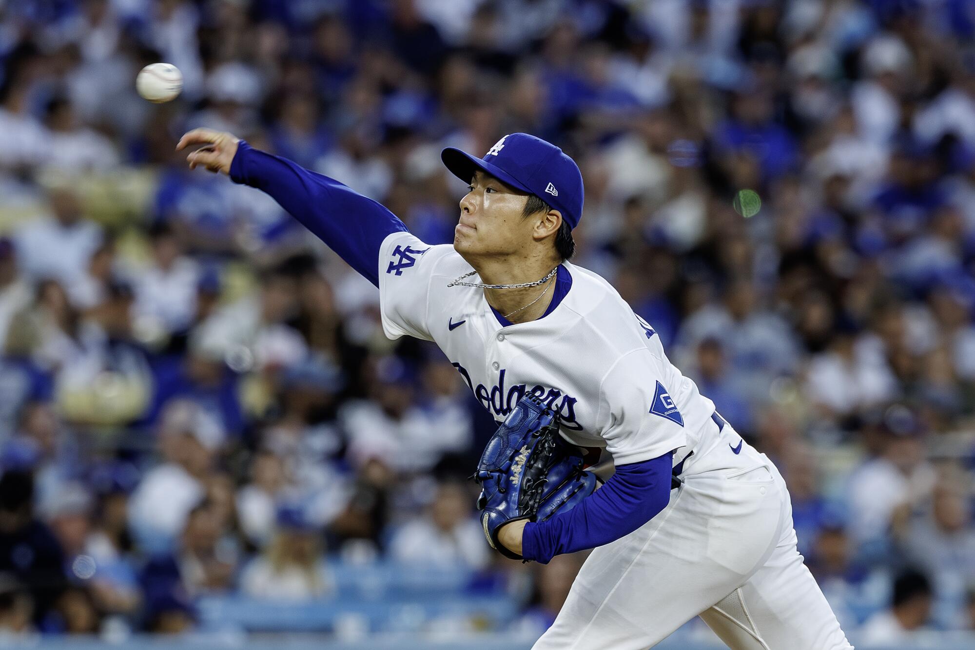 Dodgers pitcher Yoshinobu Yamamoto delivers during the first inning of a 3-1 win over the Brewers.