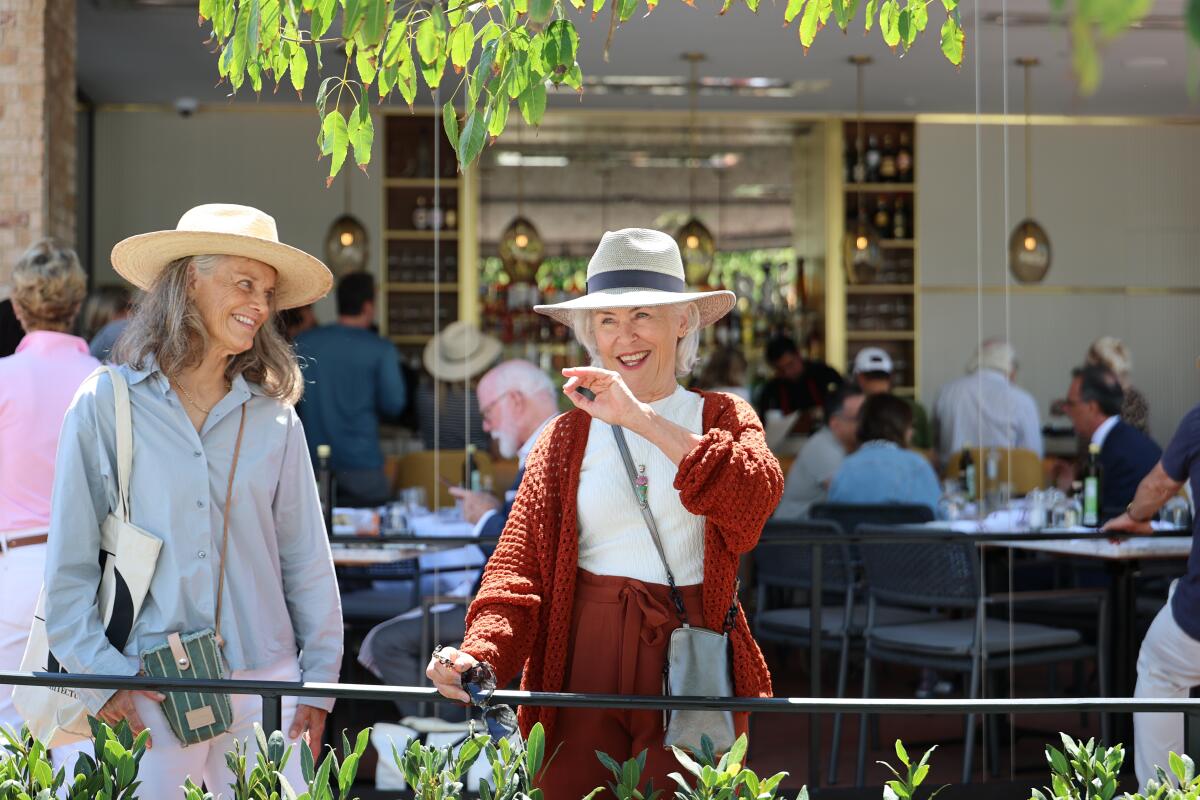 Susan Fairbairn and Gail Wirth, who both lost homes in the Palisades Fire attended the grand reopening.
