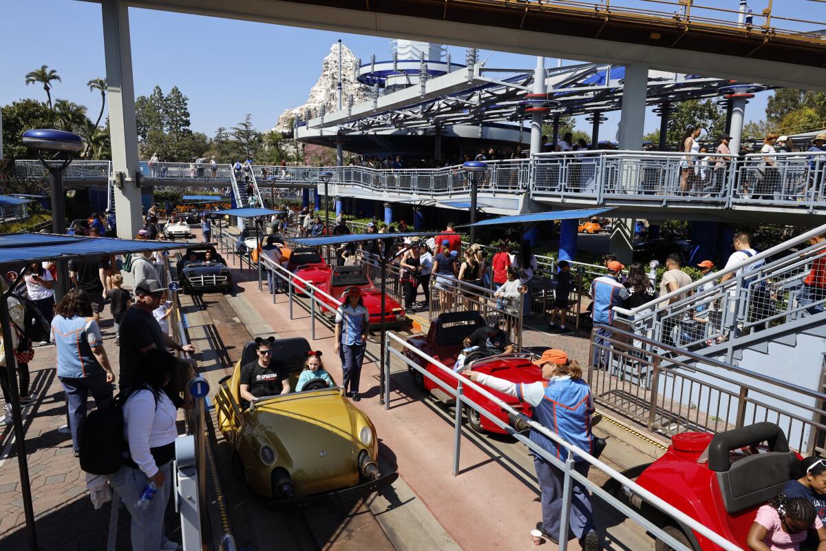 Visitors at Autopia in Tomorrowland