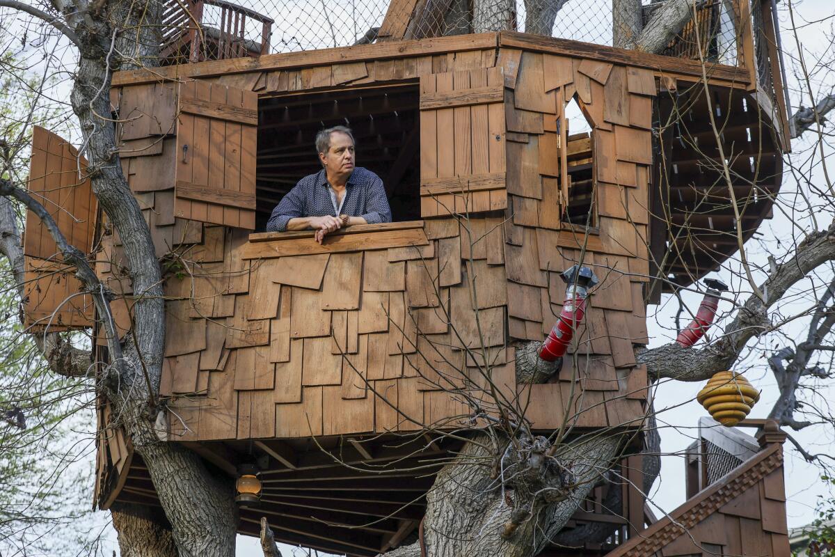 Former "Simpsons" producer Rick Polizzi  in his Sherman Oaks treehouse, known as "Boney Island," in 2025. 