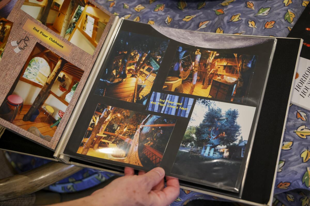 Polizzi, in 2025, flips through a scrapbook he made about Boney Island.