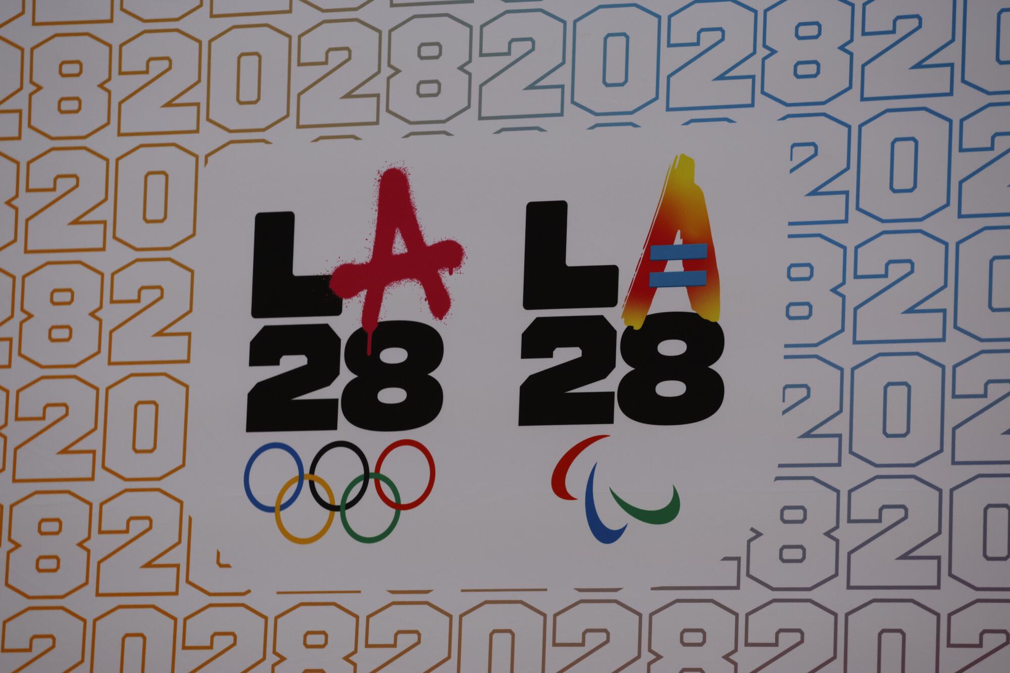 The LA28 Olympics and Paralympics logos are featured on a sign outside an event in 2024.