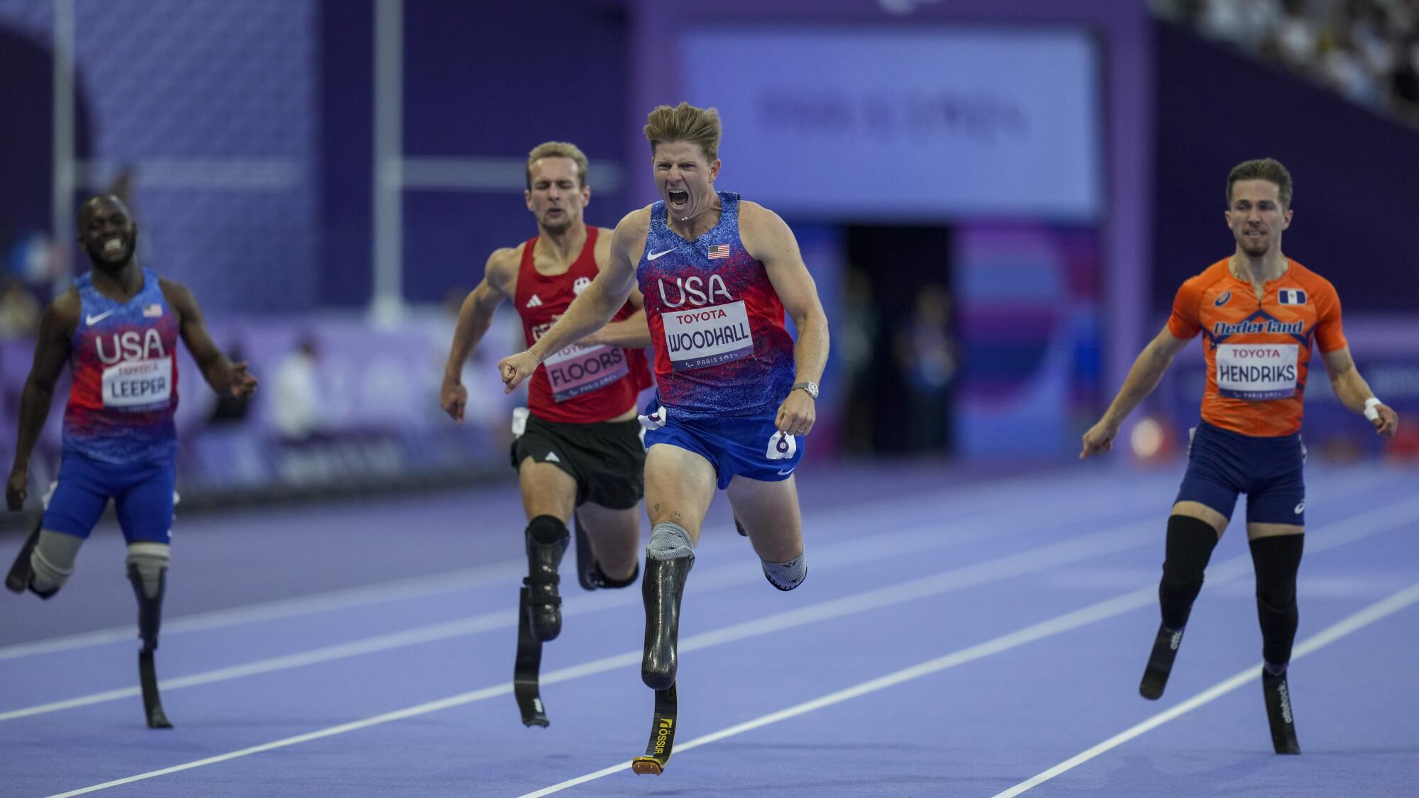 Hunter Woodhall from the U.S. wins the men's 400-meter T62 final at the 2024 Paralympics on Sept. 6, 2024, in Paris.
