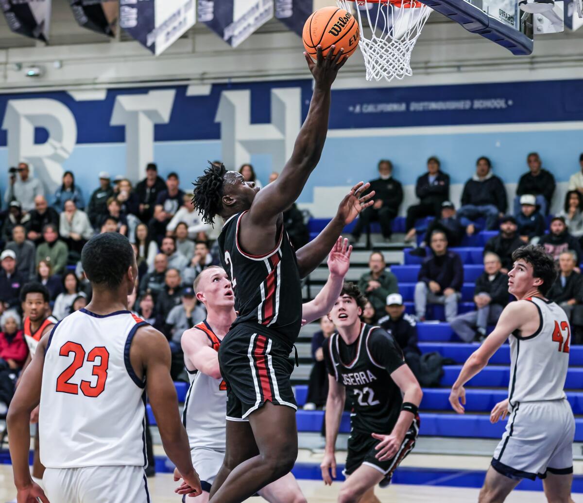 Godschoice Eboigbodin of JSerra makes a shot against Rolling Hills Prep.