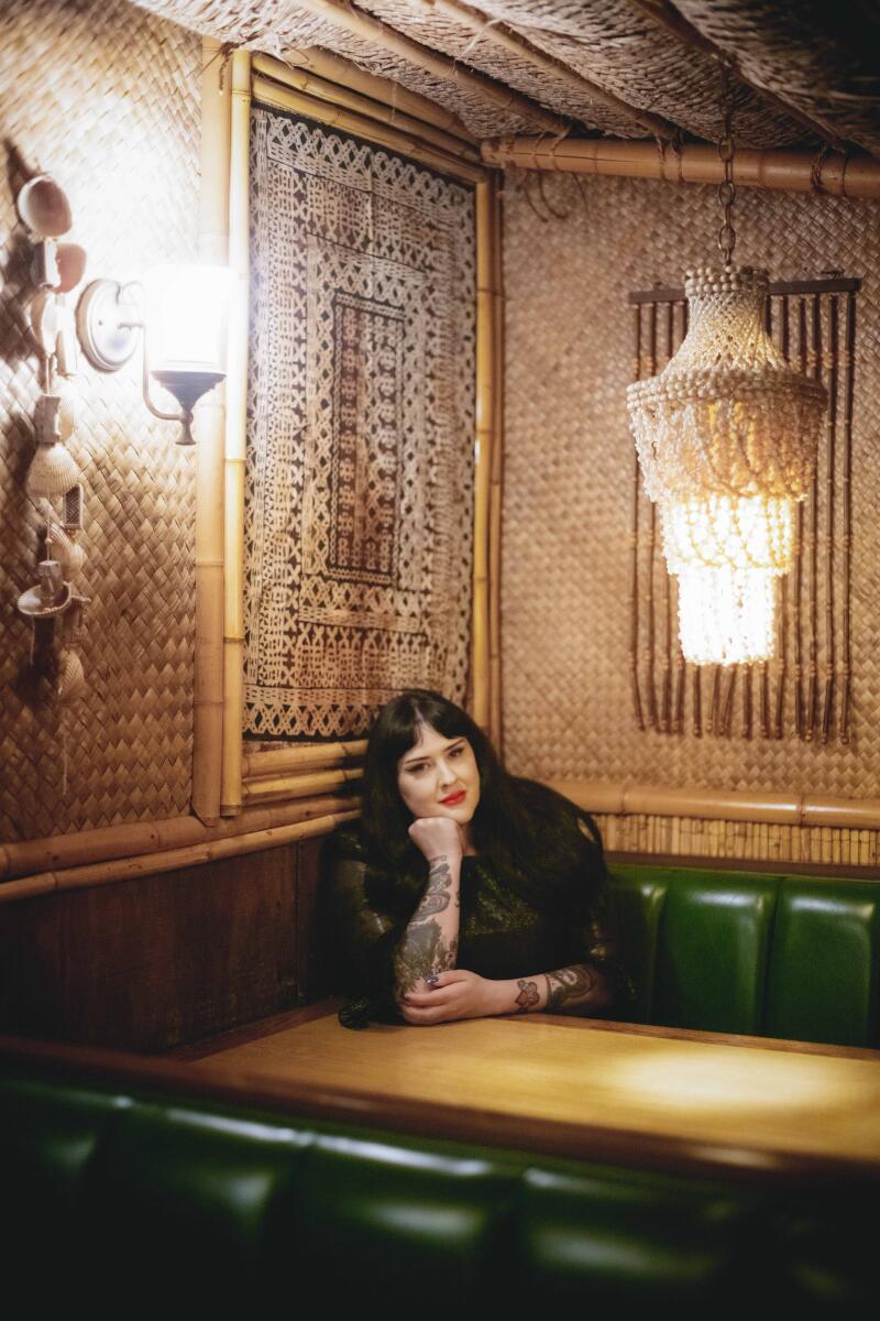 Lauren Bethke in a green booth in the private party room at Damons 2026 (Thomas Gavin)