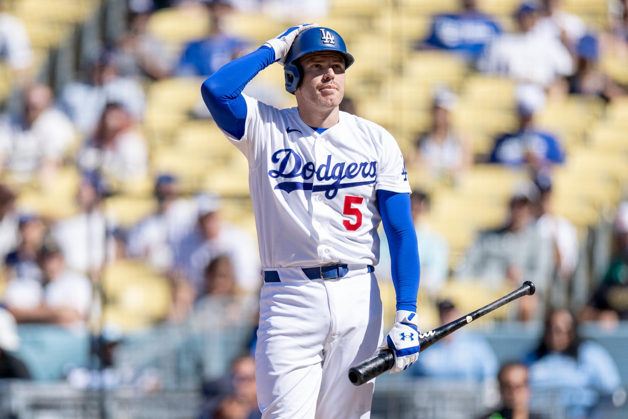 Freddie Freeman reacts to hitting a foul ball during the ninth inning of the Dodgers' 6-2 loss to the Brewers on Sunday.