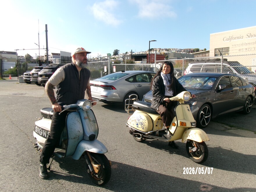 Michelle "Meng" Nguyen and Jeffrey Larrimore riding their famous scooters.