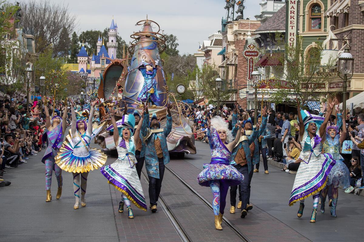 The vibrant, dance-focused "Magic Happens" parade will return to Disneyland in 2027.