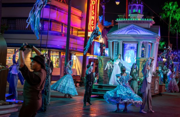 Black Widow Bride Constance Hatchaway in Madame Leota's Swinging Wake street party during Oogie Boogie Bash at Disney California Adventure. (Courtesy of Disneyland)