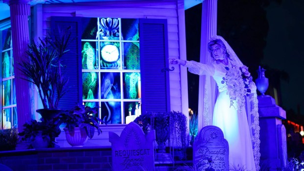 Black Widow Bride Constance Hatchaway in Madame Leota's Swinging Wake street party during Oogie Boogie Bash at Disney California Adventure. (Courtesy of Disneyland)