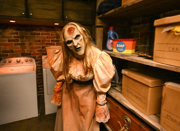 A scene from Mary: Haunting of Worth Home maze at Knott's Scary Farm in Buena Park, CA, on Thursday, Sept. 18, 2025. Ten mazes and five scare zones fill Knott's Berry Farm for the annual scare event that runs from Sept. 18 to Nov. 1. (Photo by Jeff Gritchen, Orange County Register/SCNG)