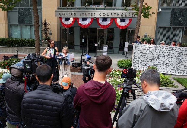 Lori Schott, center, speaks during a rally outside a federal courthouse on Tuesday, Aug. 18, 2026, in Oakland, Calif. Parents and advocates gathered in front of the courthouse holding a large banner with the names of children who died from what they claim are social media related harms. Opening statements begin on Tuesday in the landmark federal multi-state social media addiction trial against Meta. (Aric Crabb/Bay Area News Group)