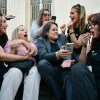 Laura Marquez-Garrett (center), a plaintiffs' attorney for the Social Media Victims Law Center, gathers with family members of victims as they react to news that the jury has found Meta and YouTube liable in the social media addiction trial, outside the Los Angeles Superior Court on March 25, 2026.