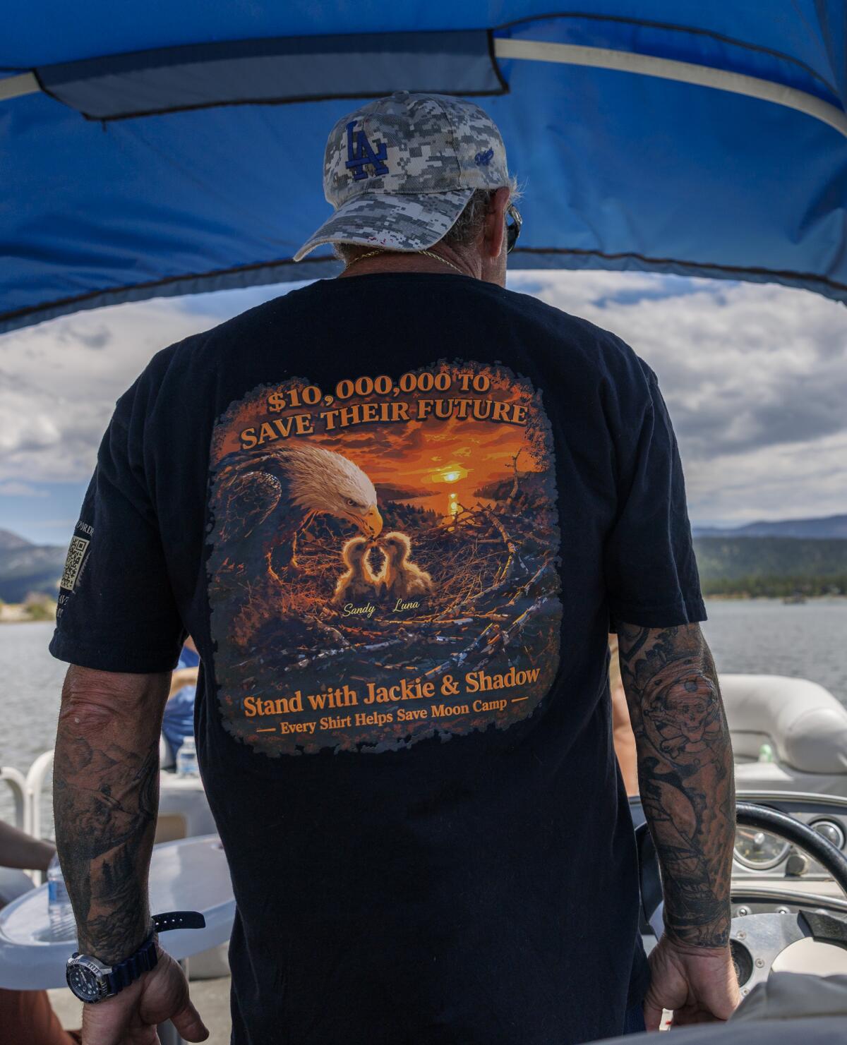 Boat captain Michael Marzell wears a T-shirt dedicated to saving resident eagles Jackie and Shadow.