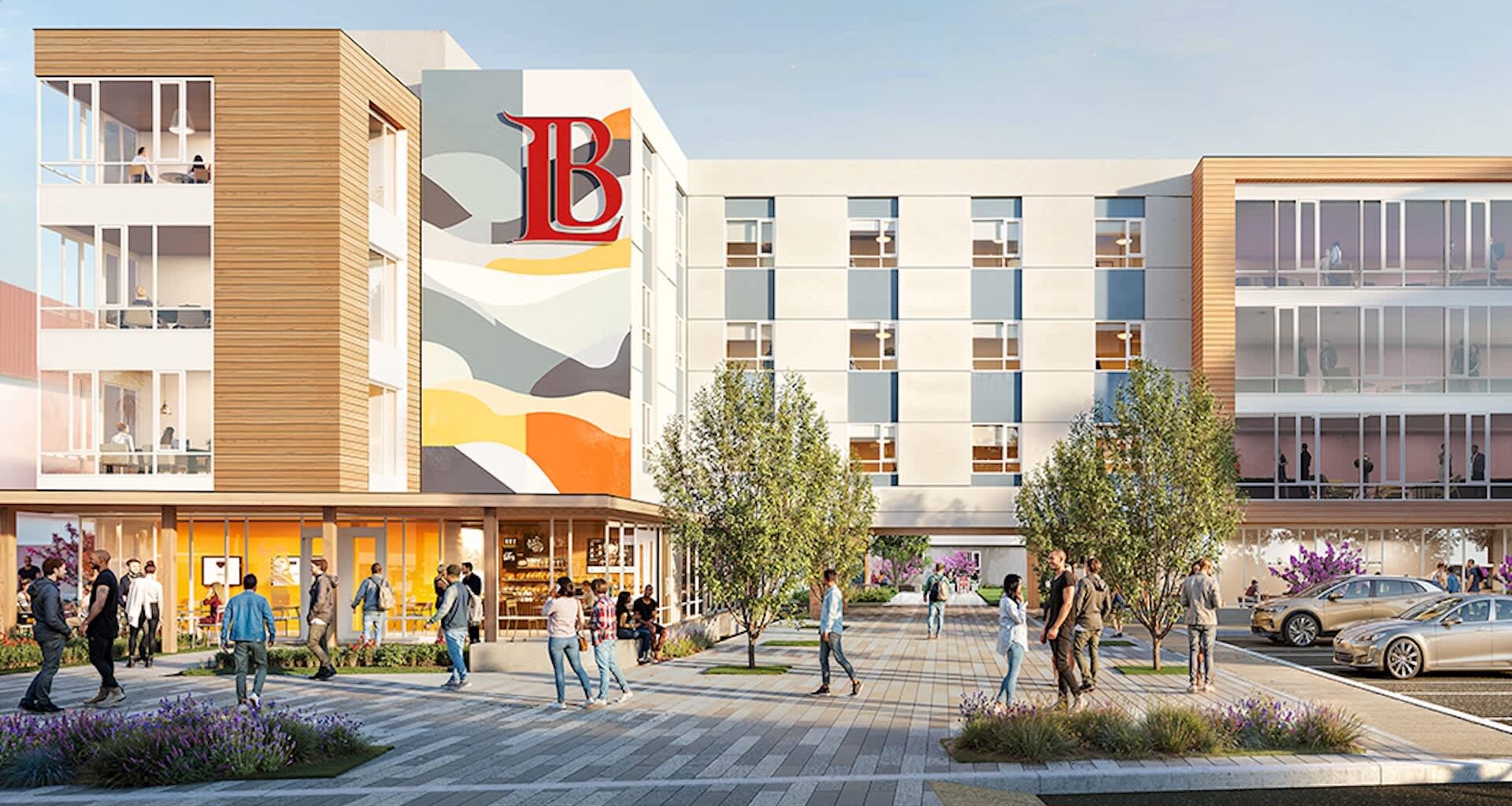A modern building with a colorful mural, surrounded by people and landscaped areas.