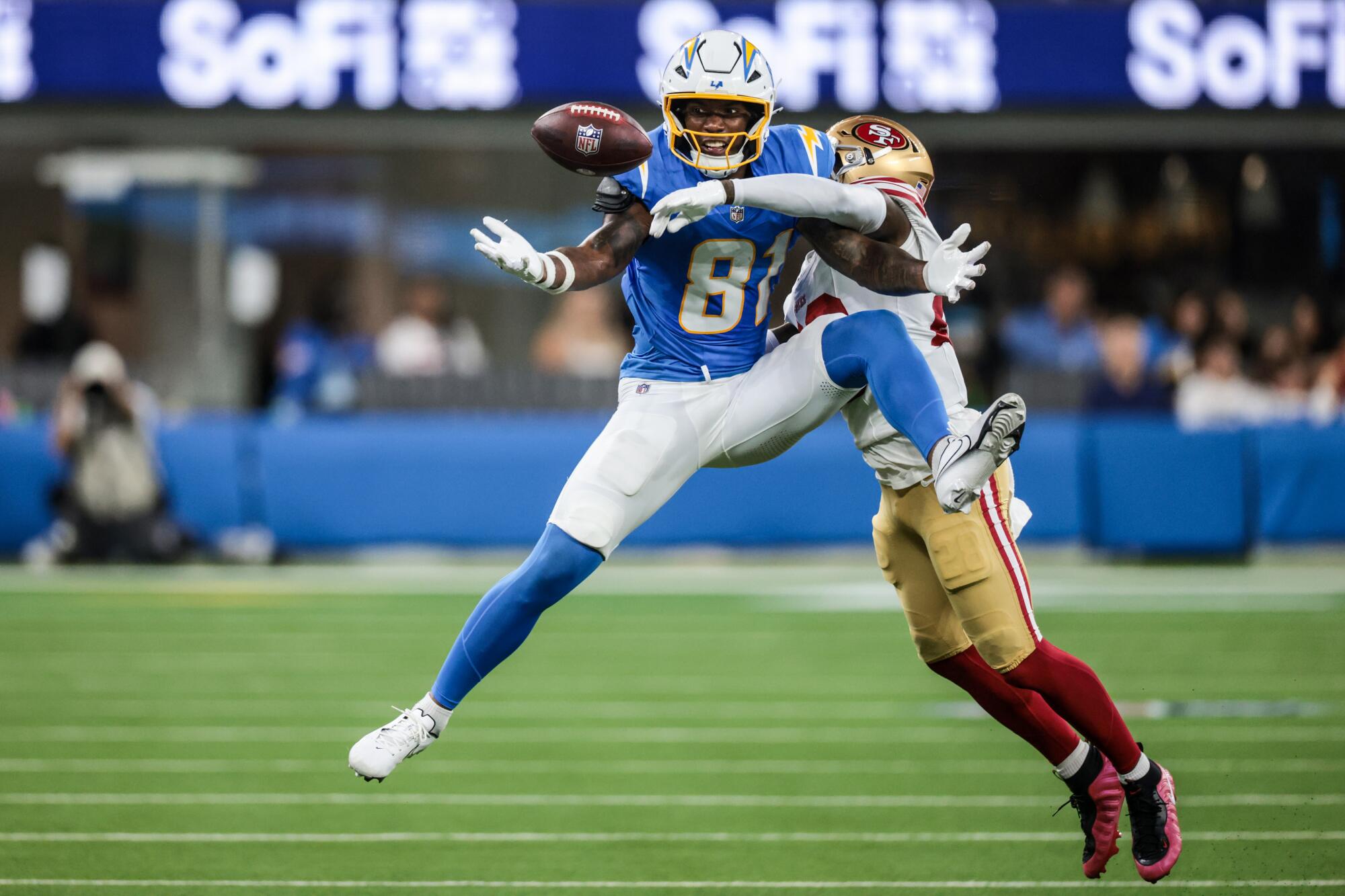 49ers cornerback Darrell Luter Jr., right, breaks up a pass intended for Chargers wide receiver Dalevon Campbell 