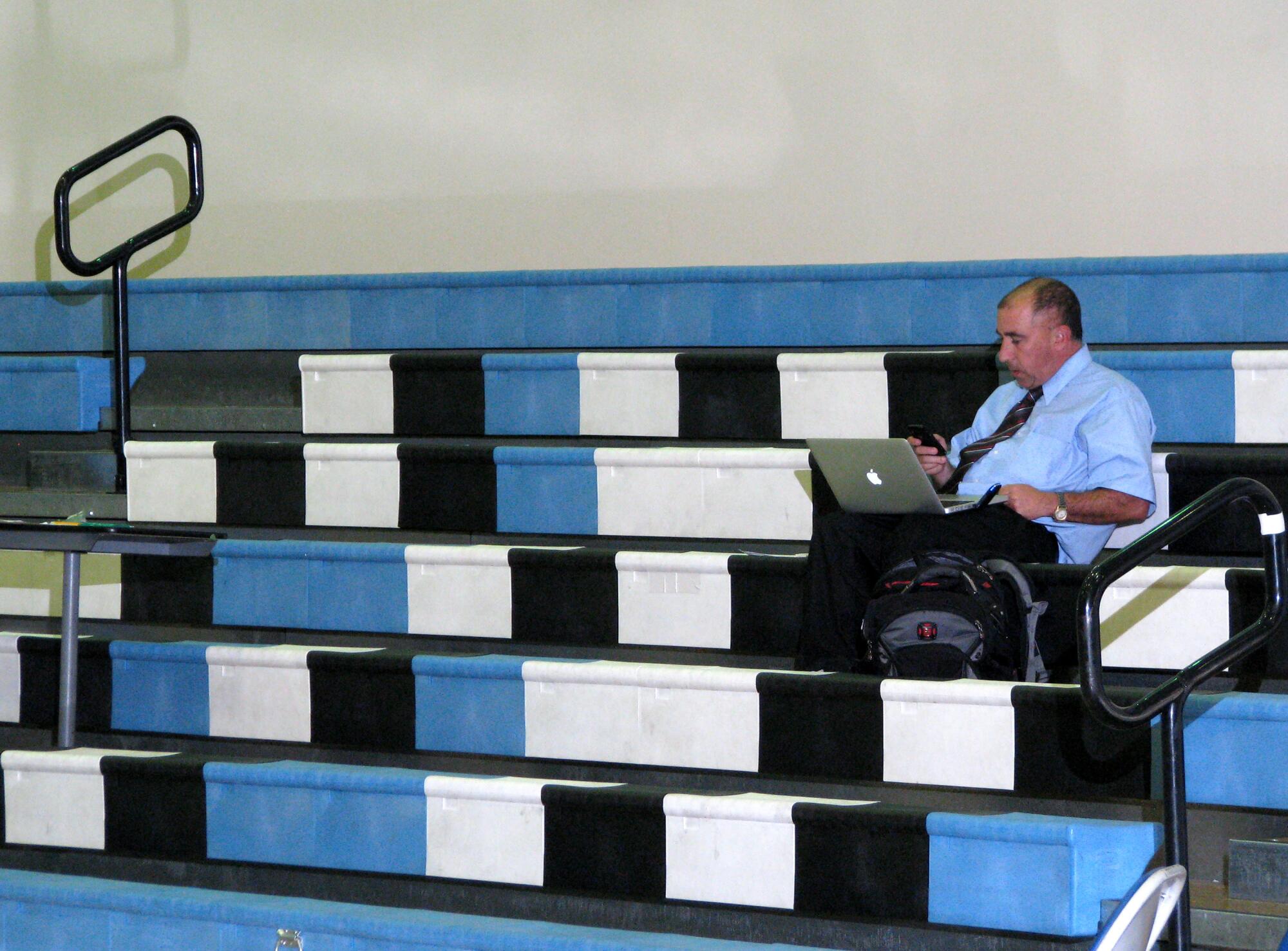 Eric Sondheimer works in an empty gym after a basketball game at Loyola High.