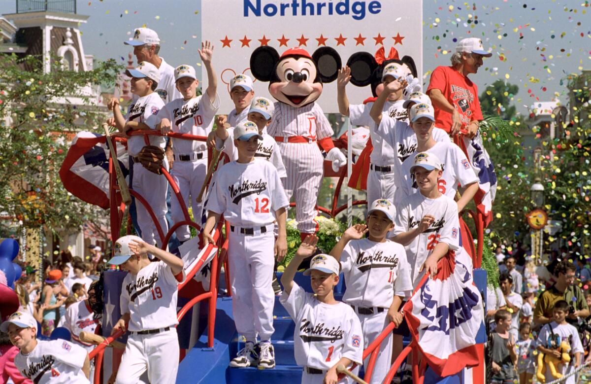 .The Northridge Little League All-Star team from 1994 was honored with a ticker-tape parade down Disneyland's Main Street.
