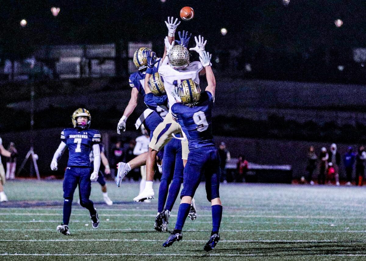 Birmingham's Peyton Waters, center, tries to outjump Del Norte defenders for a Hail Mary pass in the final seconds of a game.