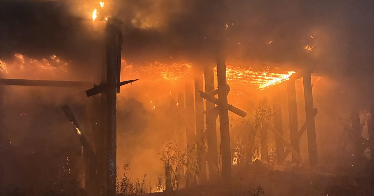 Oakland firefighters mopping up blaze that consumed abandoned train trestles near EBMUD facility