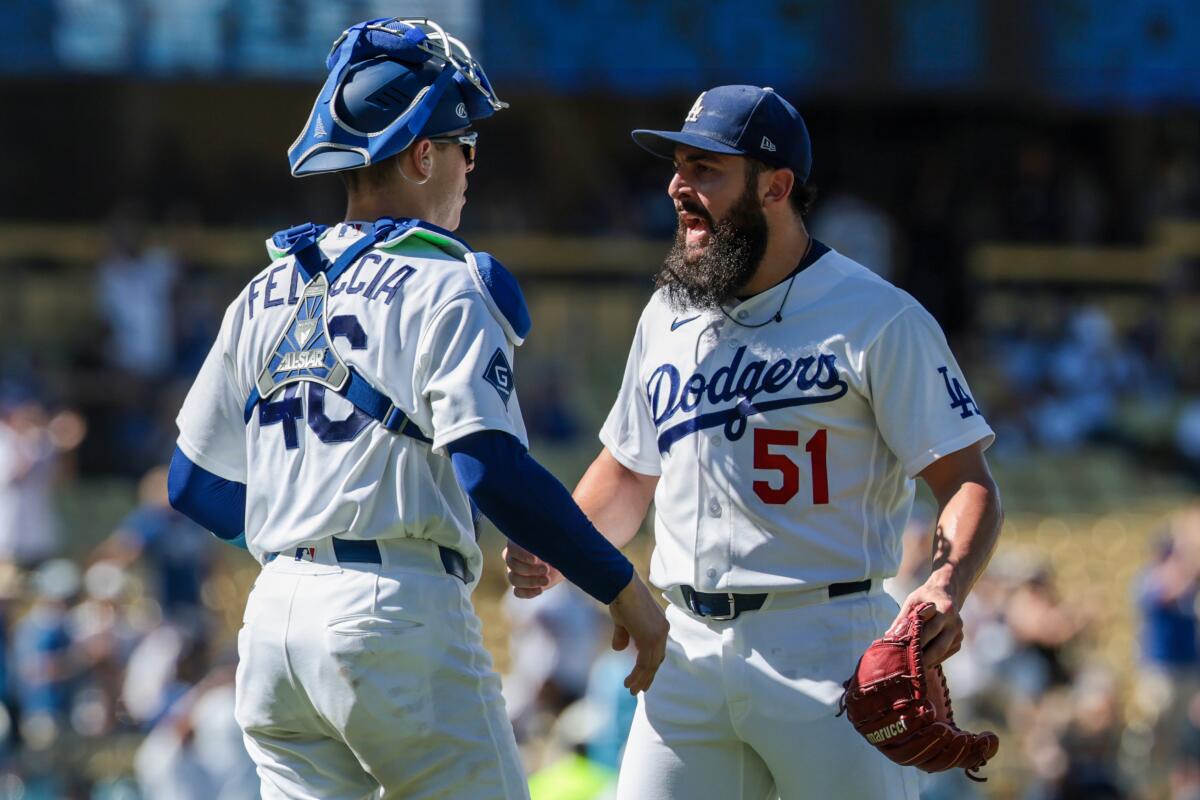 Dodgers reliever Alex Vesia celebrates with catcher Hunter Feduccia against the Pirates.