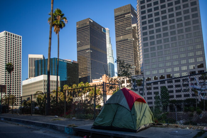 A tent on a city sidewalk