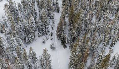 A aerial view of a snow-covered road is seen by the Castle Peak Trailhead near Soda Springs, Calif on February 20, 2026