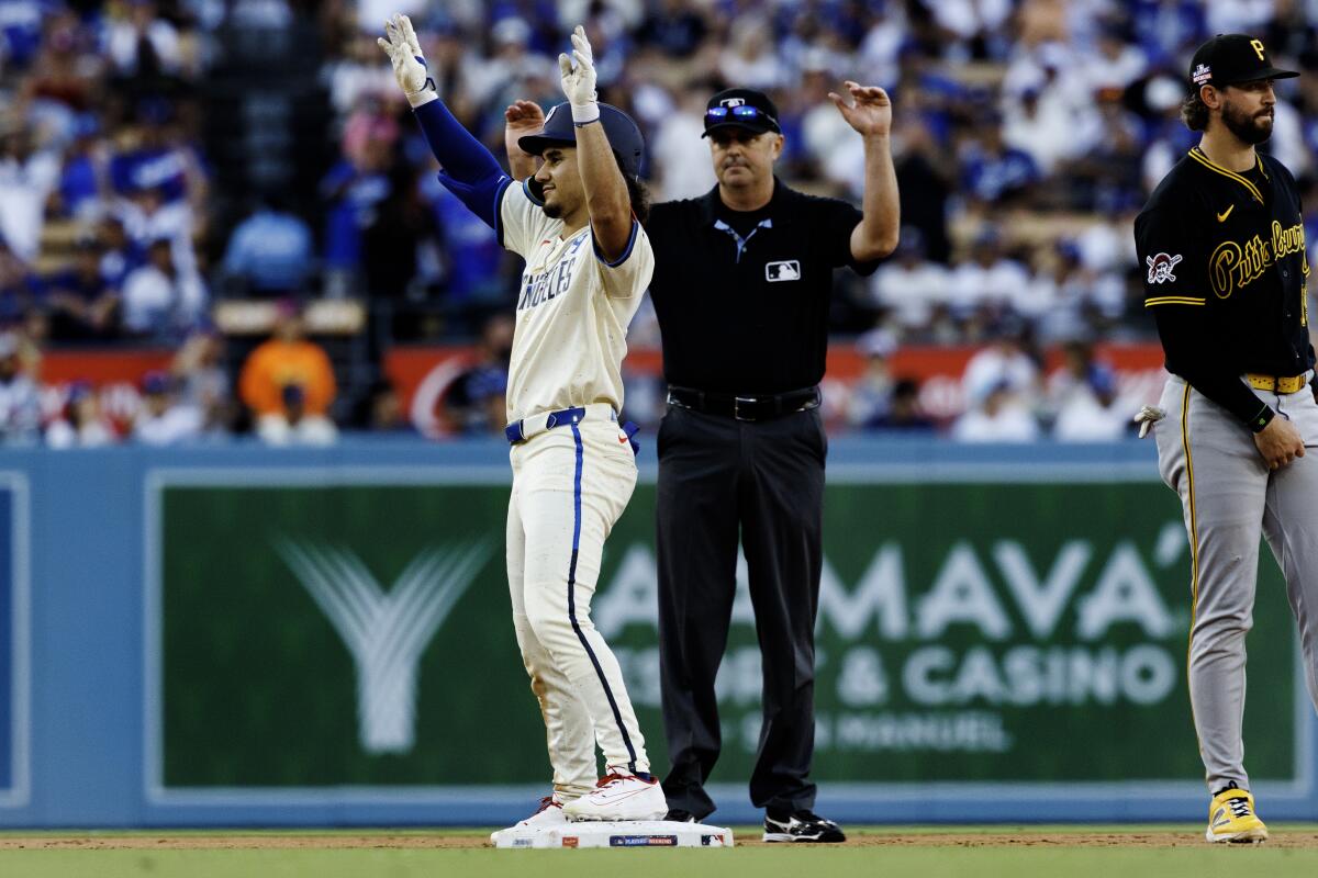 Alek Thomas gestures toward the dugout after reaching second base on Saturday.