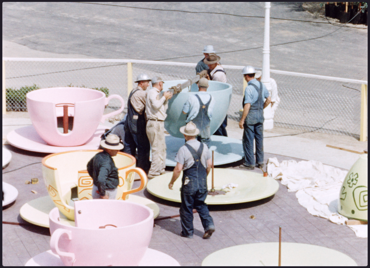 A swirling tea cup ride under construction. 