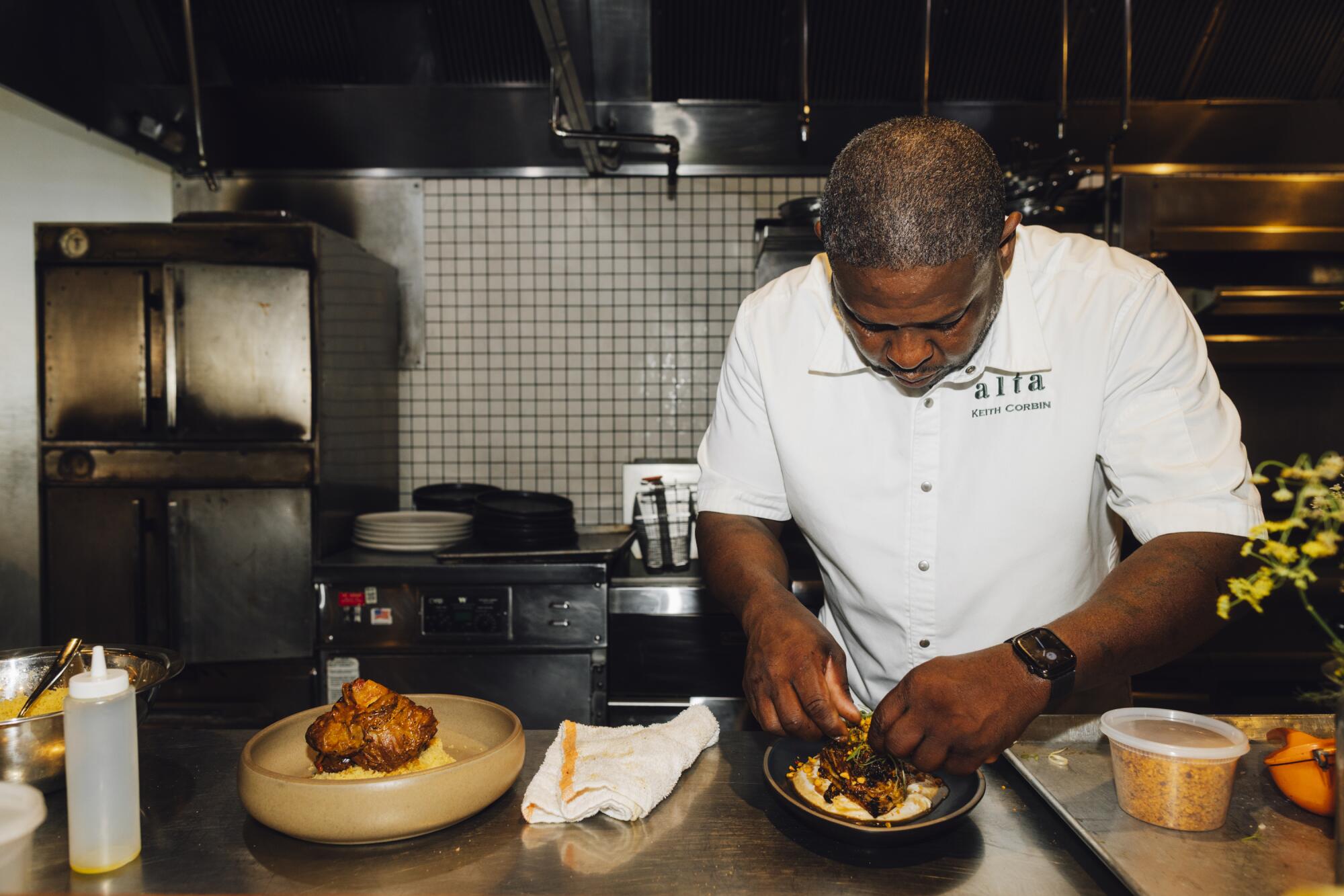 Chef Keith Corbin prepares a roasted cabbage dish at Alta Adams in West Adams.