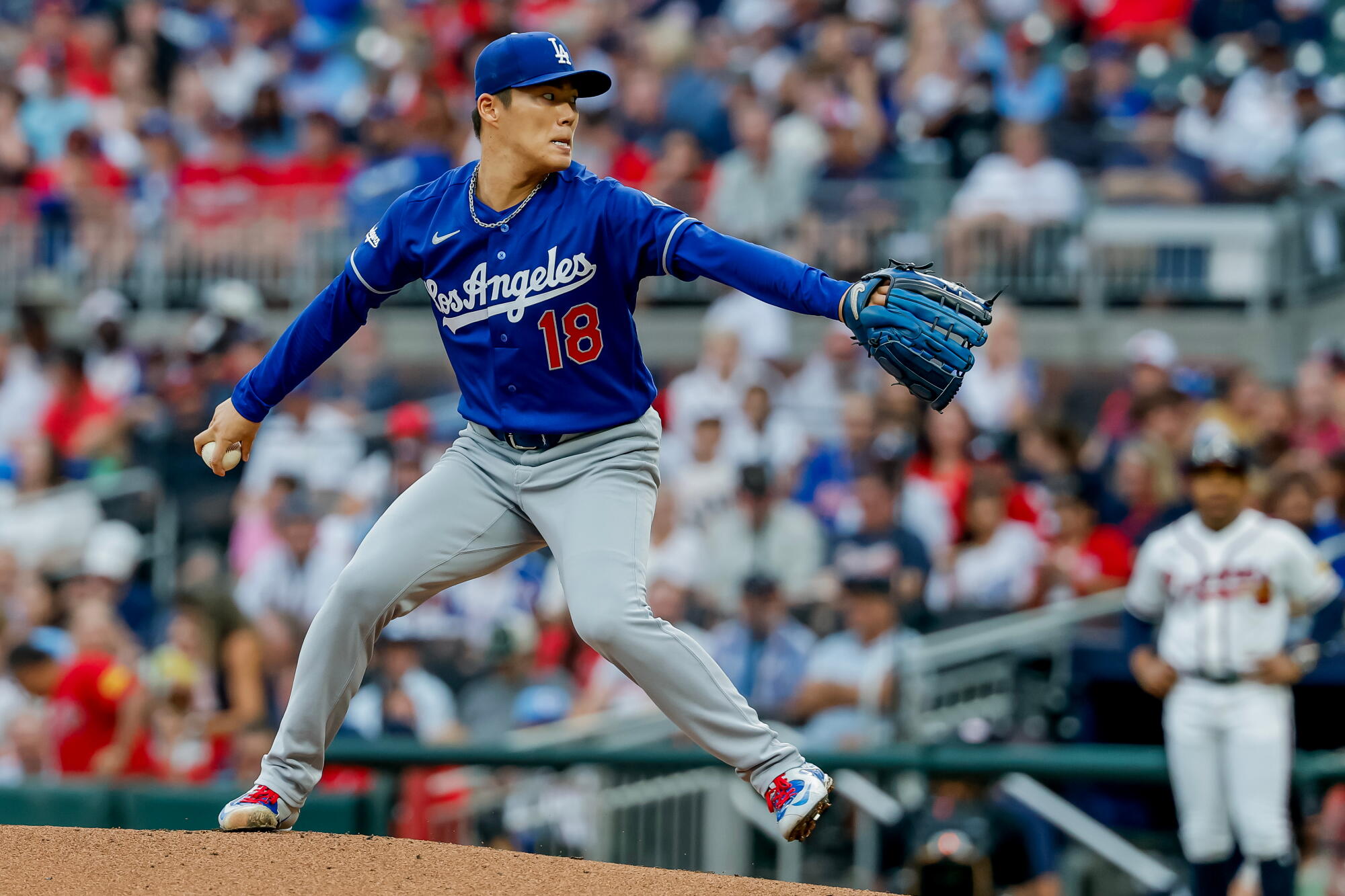 Dodgers pitcher Yoshinobu Yamamoto delivers against the Atlanta Braves in the first inning Thursday.