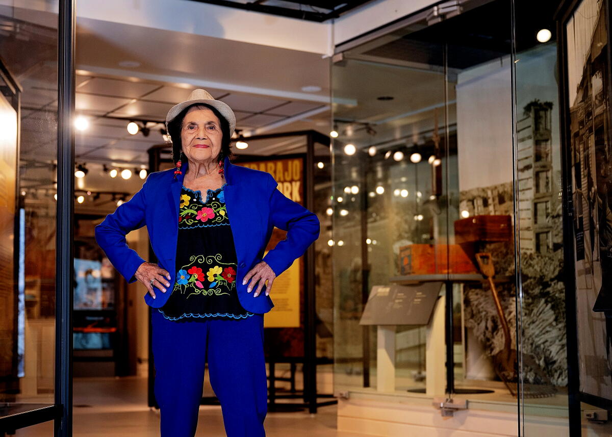 Dolores Huerta photographed at Dolores Huerta "Help Wanted/Leave Now" exhibit at California Museum. 